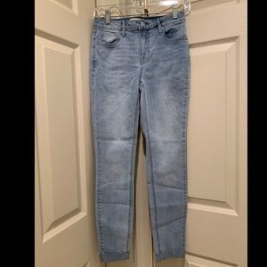 Light blue mid rise skinny jeans
